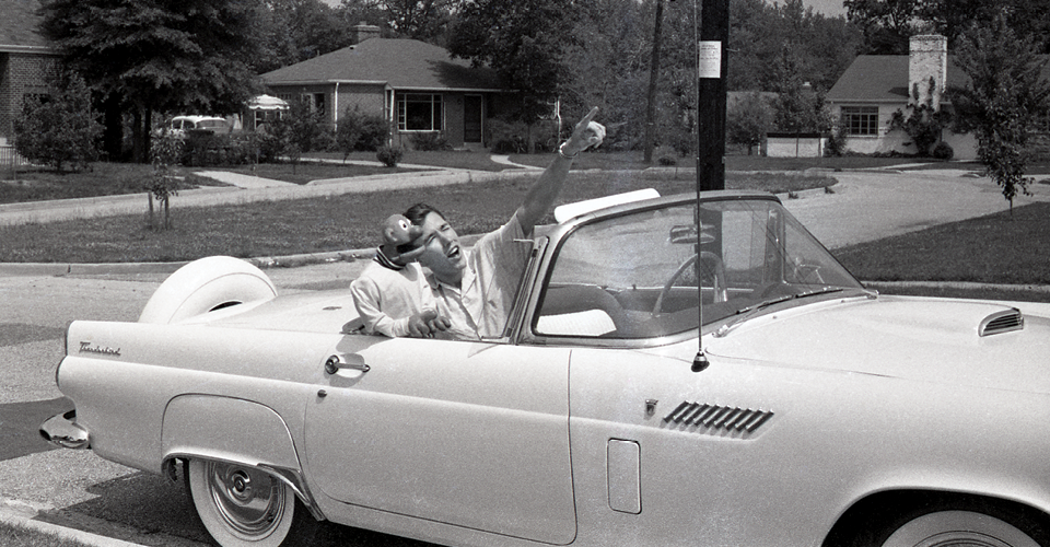 Jim Henson with puppet in car