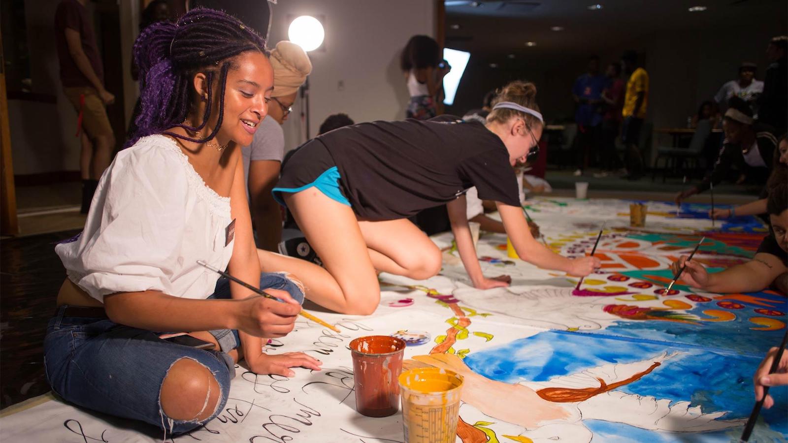 students paint the Unity Mural at NextNOW Fest