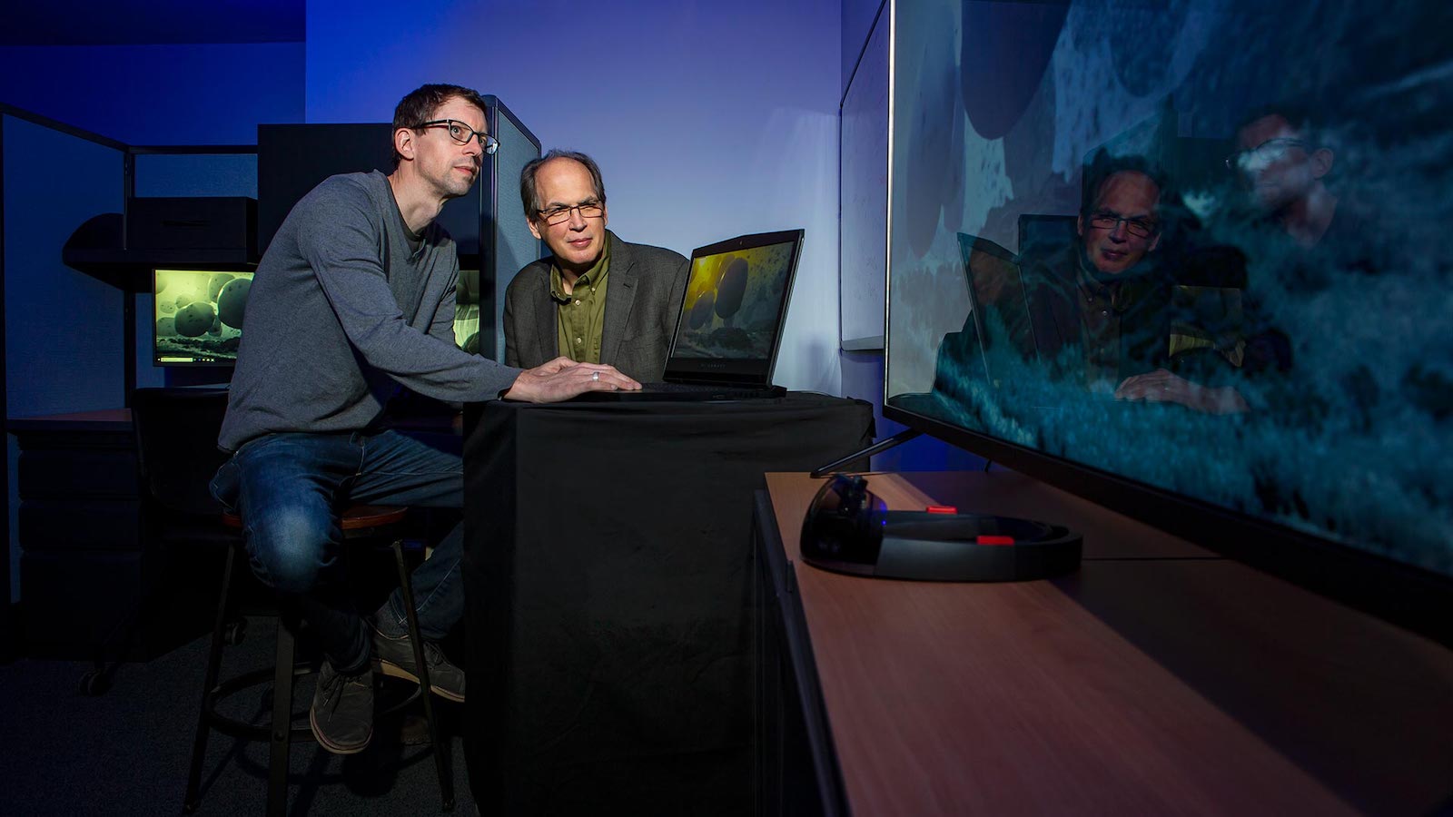 Brandon Morse and Roger Eastman at a computer