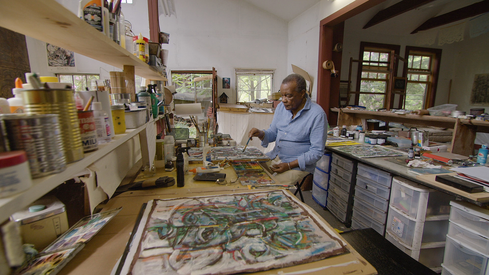 image of David Driskell painting in his studio