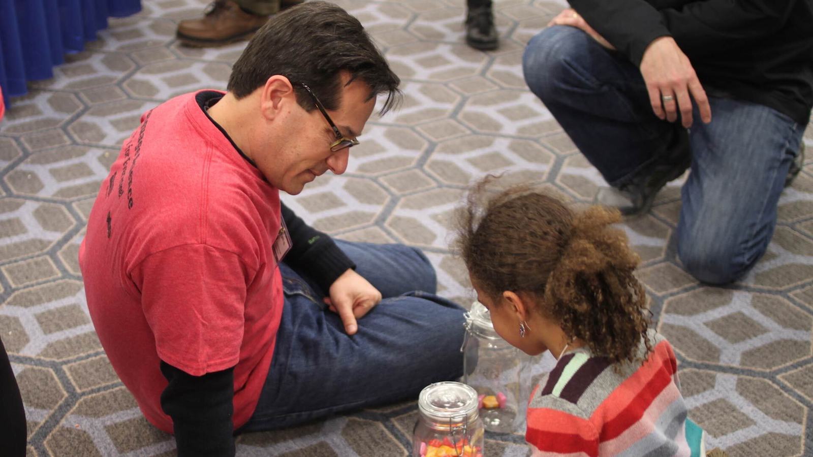  Linguistics Professor Jeff Lidz talks about adjectives with an aspiring child scientist at Family Science Days at the American Association for the Advancement of Science annual meeting in 2016.