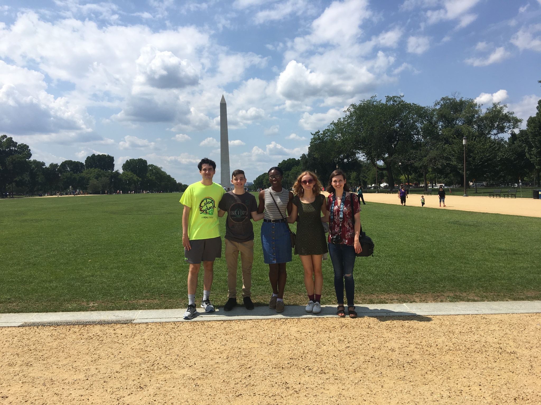 Honors Humanities students pose in front of the Washington Monument on the National Mall.