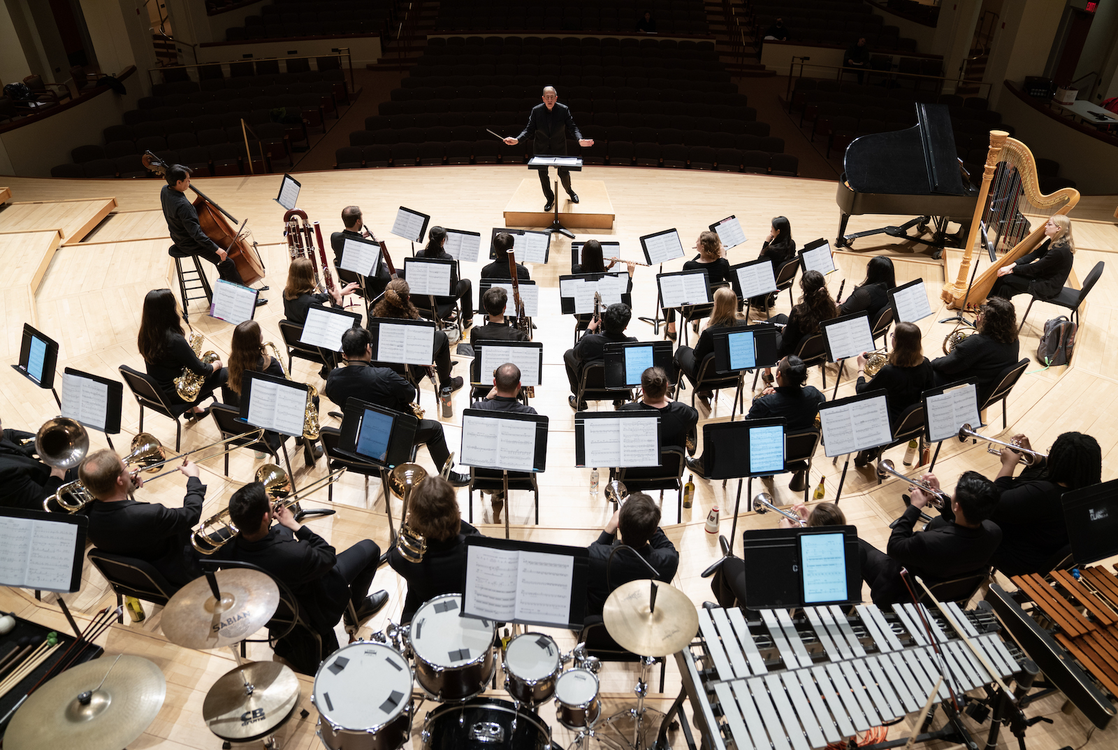 The University Wind Orchestra performs on stage.