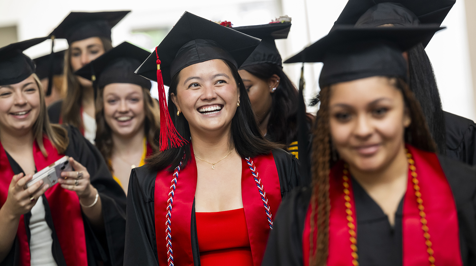  ARHU graduates smile on graduation day.