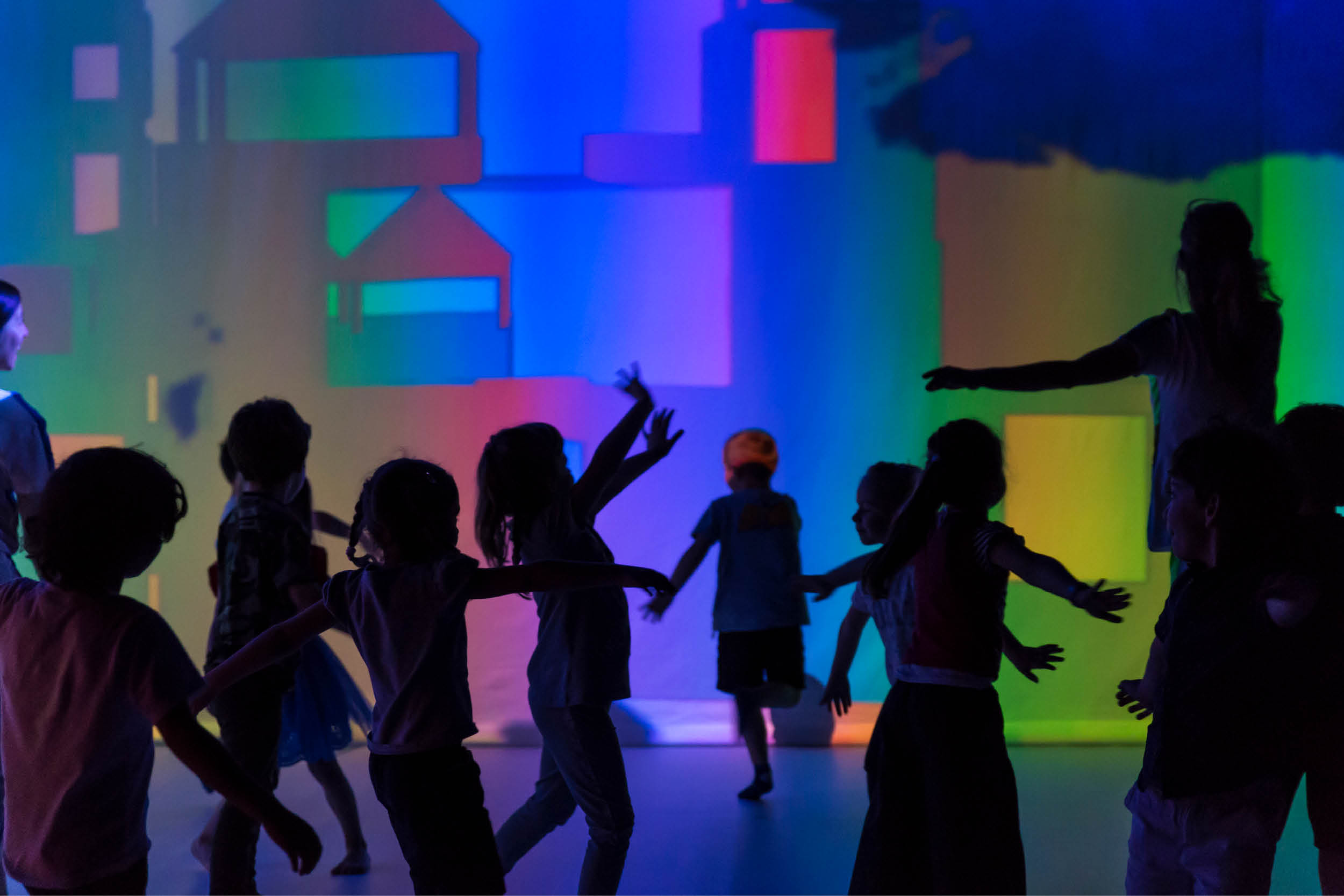 Children dancing at an interactive performance.