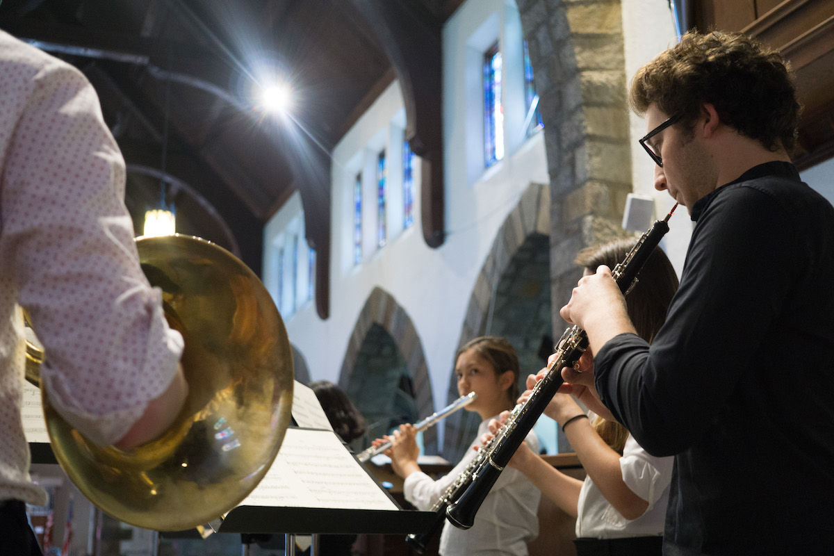 NOI fellows play instruments in St. Andrew's Episcopal Church.
