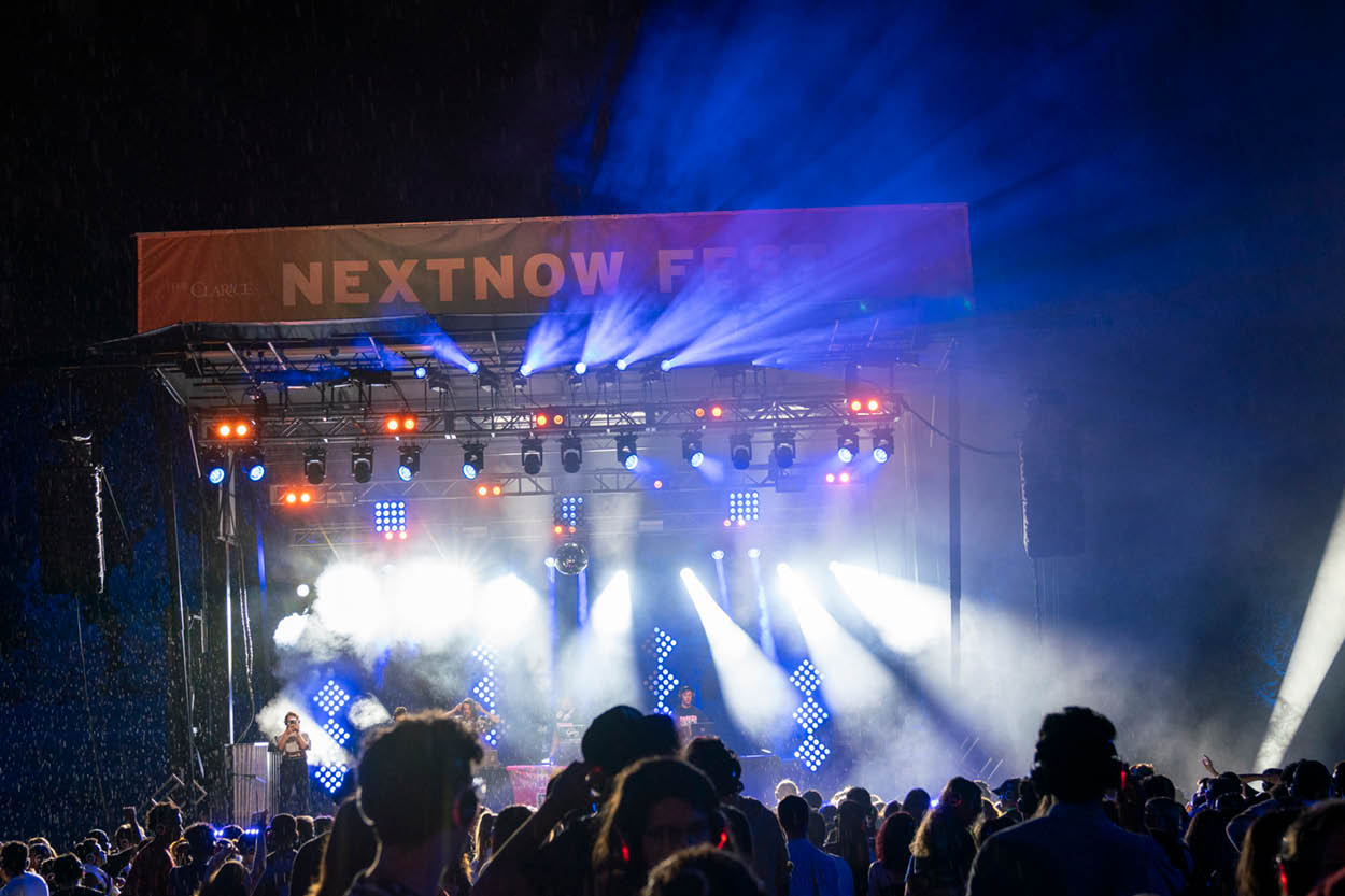 A crowd gathers around an outdoor stage at NextNOW Fest.