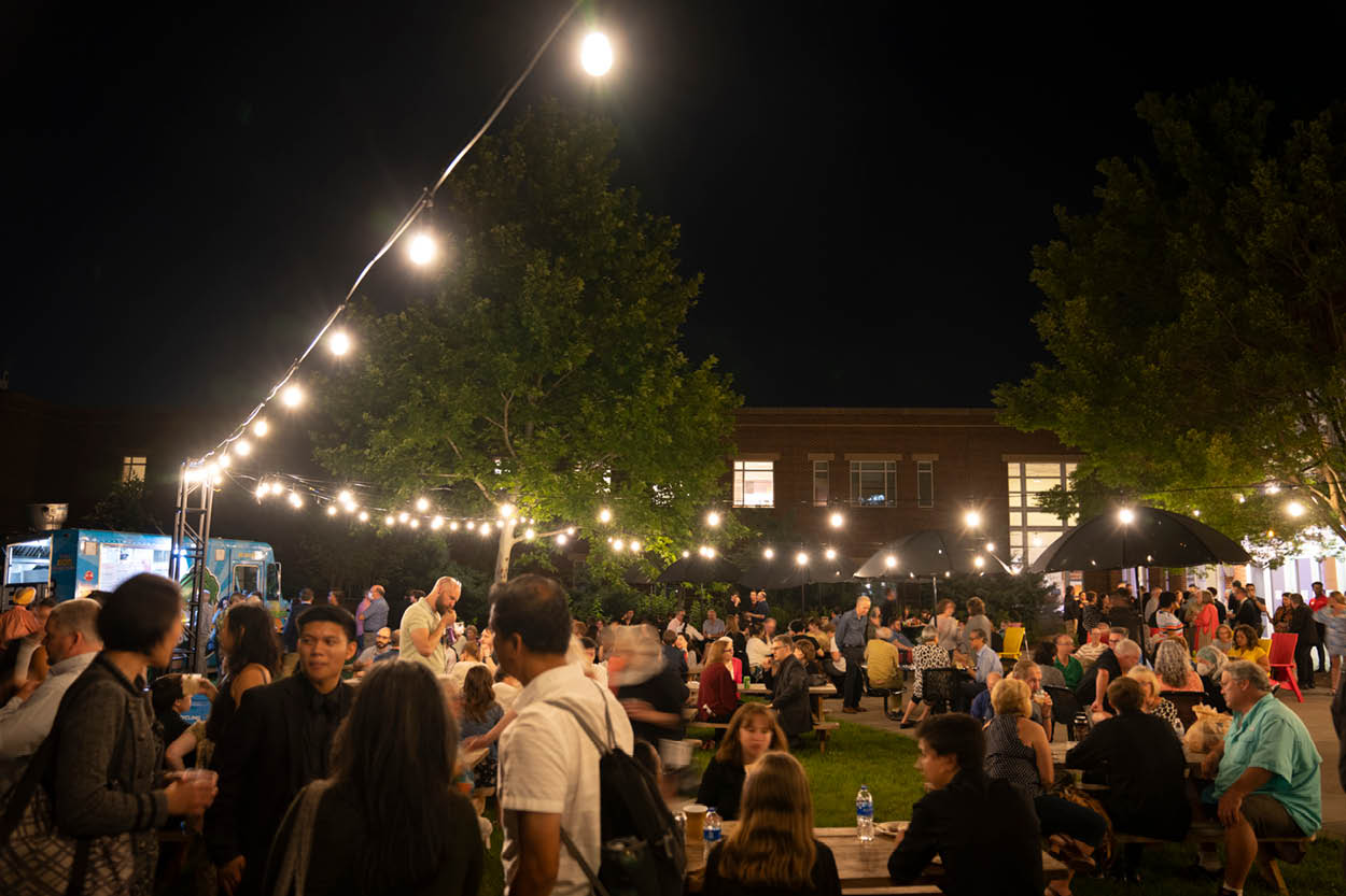 People gather in The Clarice's courtyard for food and drink.