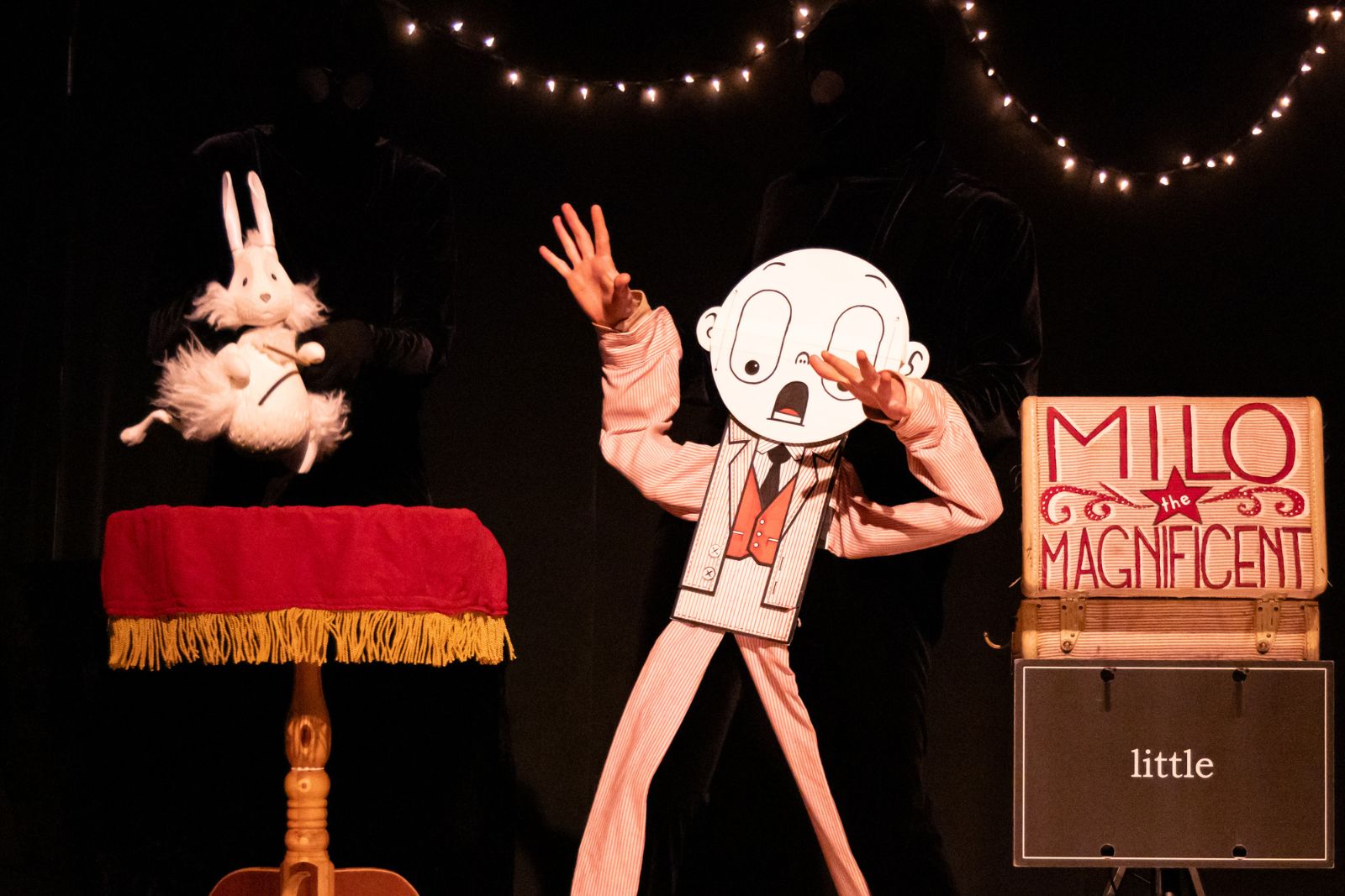 Milo the puppet looks surprised to see a rabbit puppet during a performance.