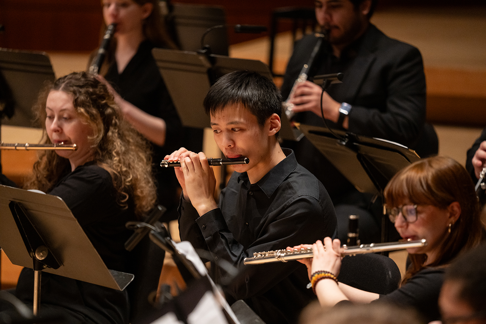 The UMD Wind Orchestra performs on stage.