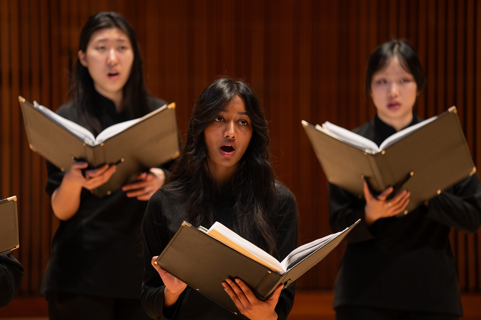 Choral students sing.