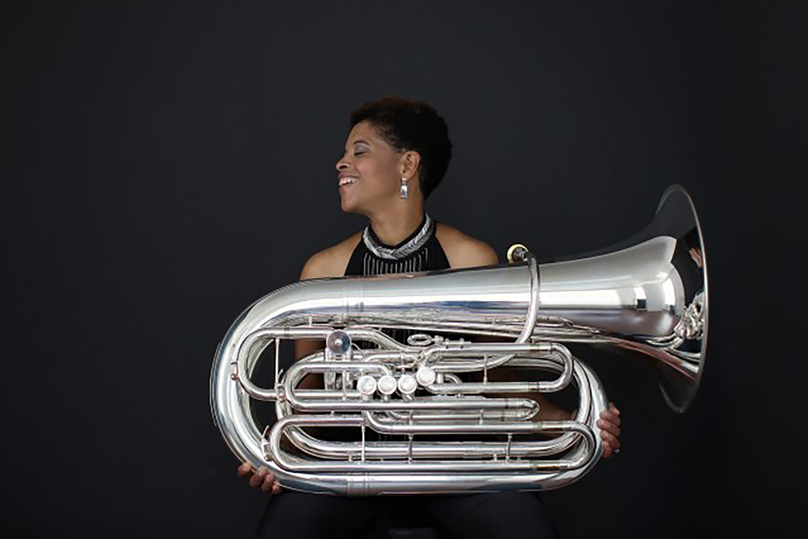 Portrait of recording artist Velvet Brown with a tuba