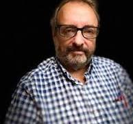 Professor Seth Schwartz against a black background