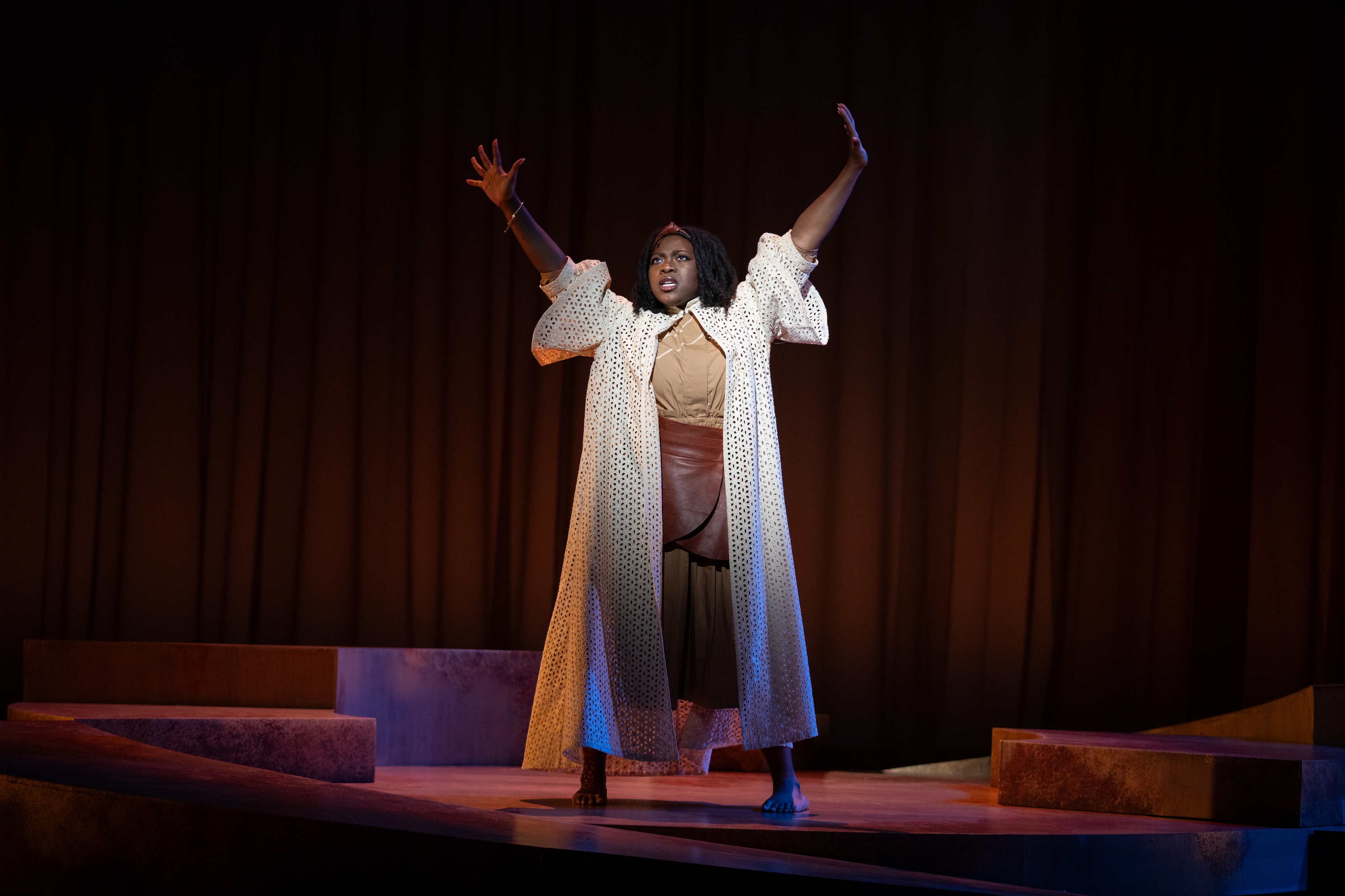 TDPS student Alaina Jenkins on stage as Lady in Brown in "for colored girls..."