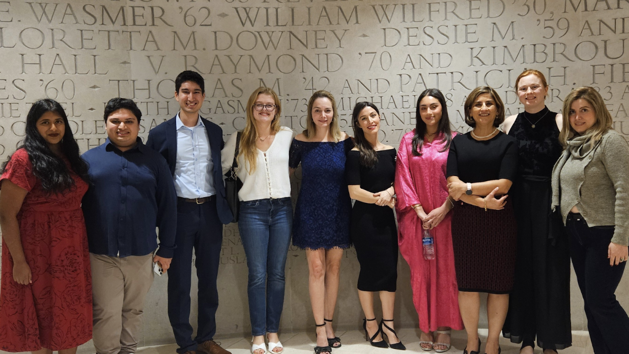 Persian Flagship students and faculty at an Iranian cultural event smiling for the camera.