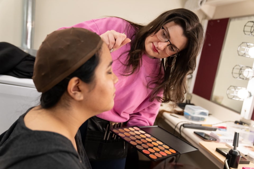 Performers spend several hours prior to rehearsals and performances having their hair and makeup done.