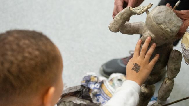 Child playing with a puppet