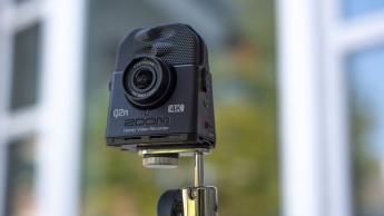  The Zoom Q2N-4K video recorder on a tripod stand.